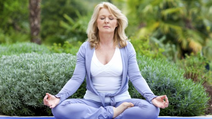 mature woman in yoga position